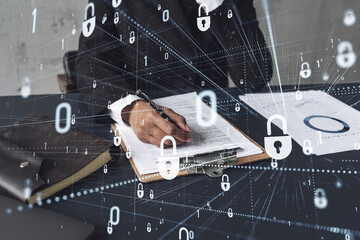 Wall Mural - African American businesswoman in formal wear signing the contract to prevent probability of risks in cyber security. Padlock Hologram icons over the working desk. Women in business concept.