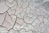 Fototapeta  - Dried cracked clay.Abstract background. Drought, ecology concept