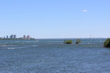 St Lawrence River With Champlain Bridge In Distance Near Montreal, Qc