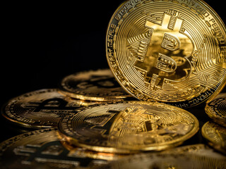 Bitcoin technology background. Close-up shiny golden bitcoin on dark background with copy space. Cryptocurrency investment concept. Digital future coin currency financial background.