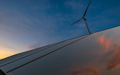 Wall Mural - beautiful sky at sunrise reflecting in photovoltaic panels