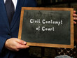 Conceptual photo about Civil Contempt of Court with written text on the chalkboard.