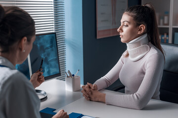 Wall Mural - Injured woman with cervical collar in the doctor's office