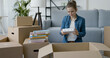 © StockPhotoPro - Young woman unpacking in her new home