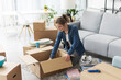 © StockPhotoPro - Woman unpacking in her new apartment