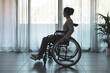 © StockPhotoPro - Woman in wheelchair at home alone