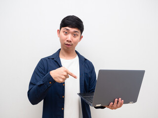 Man feel get idea and point finger at laptop in his hand look at camera on whit background