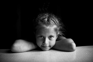 Wall Mural - Portrait of little girl close up. Black and white photo.