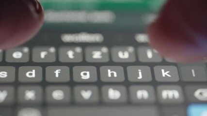 Person texting on a smartphone, macro footage closeup.