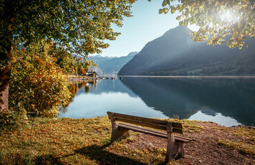 Fototapete - Stunning autumn landscape. View on lake shore in Grundlsee lake in Austrian Alps. Grundlsee lake is popular travel destination. Idea of travel in world. Best famouse hiking locations. luxury resort