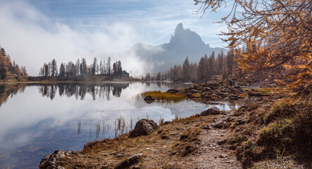 Fotomurali - Wonderful foggy autumn landscape. View on Federa Lake early in the morning at autumn during sunrise. Federa lake. Dolomites Alps. Amazing wild nature. Best famouse hiking locations. Great nature scene