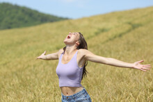 Excited Woman Screaming In A Wheat Field