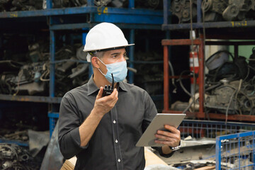 Engineer man working, Caucasian manager using walkie-talkie in factory-warehouse