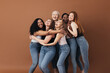 canvas print picture - Six laughing women of a different race, age, and figure type. Group of multiracial females having fun against a brown background.