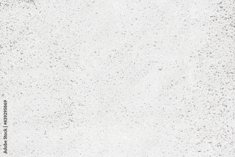 Whitewashed exposed aggregate concrete texture. White rough cement with ...