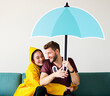 © Rawpixel.com - Couple under an umbrella icon