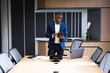 © Wavebreak Media - African american businessman using digital tablet in meeting room at office