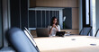 © Wavebreak Media - Caucasian businesswoman using laptop while sitting in meeting room at modern office