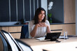 © Wavebreak Media - Caucasian businesswoman using laptop while sitting in meeting room at modern office