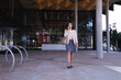 © Wavebreak Media - Caucasian businesswoman talking on a smartphone while walking at corporate park