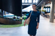 © Wavebreak Media - Portrait of a caucasian businesswoman smiling while standing at modern office