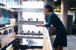 © Wavebreak Media - Caucasian businesswoman using smartphone while standing in the corridor at modern office