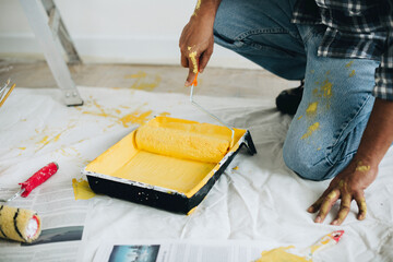 Wall Mural - Man painting the walls yellow