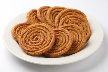 Wall Mural - Indian Traditional Tea Time Snack Chakli, a deep fried snack, It is known as Chakali, Murukku, Muruku, Murkoo, Chakri.
