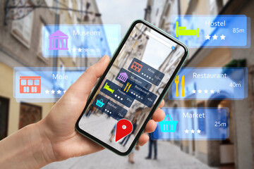 Tourist using online guide application on smartphone for navigation in city, closeup. Augmented reality information technology