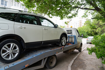 car is transported on tow truck.transporting cars after accidents and breakdowns