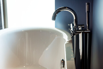 Wall Mural - Bathtub faucet closeup with luxury living concept