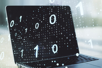 Wall Mural - double exposure of creative abstract binary code hologram on laptop background. database and program