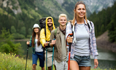 Wall Mural - group of happy friends enjoying outdoor activity together