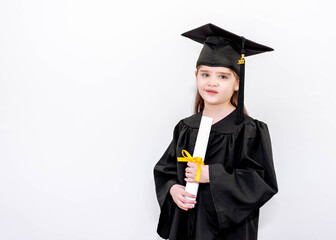 Wall Mural - preschool graduation girl with toga and graduation hat white background 