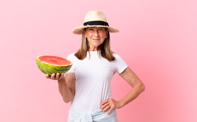 middle age pretty woman with a watermelon. summer concept