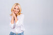 © denis_vermenko - Happy elegant mature senior business woman smiling standing isolated on white background. Smiling confident cheerful middle aged lady with white smile looking at camera, copy space.