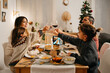 © Sergio Marcos/Stocksy - Loving family toasting for christmas while congratulating family in video chat