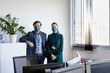 © ALTO IMAGES/Stocksy - Co-worker businessmen in the office
