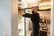 © Hernandez & Sorokina/Stocksy - Chef Putting Tray Into The Fridge