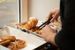© Hernandez & Sorokina/Stocksy - Anonymous Man Taking Pastry