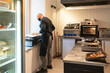 © Hernandez & Sorokina/Stocksy - Chef In His Small Restaurant Kitchen
