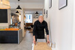 © Hernandez & Sorokina/Stocksy - Waiter Set The Table At Cafeteria