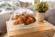 © Hernandez & Sorokina/Stocksy - Croissants In Glass Utensil With Cover