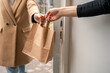 © Hernandez & Sorokina/Stocksy - Anonymous Take Away At Restaurant Doorway
