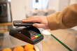 © Hernandez & Sorokina/Stocksy - Payment Using Smartphone Indoors