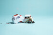 © Catherine MacBride/Stocksy - Two Car Collision, of paper craft cars