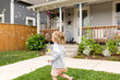 © Jennifer Bogle/Stocksy - Blonde girl runs in yard full of bubbles