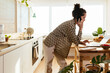 © BONNINSTUDIO/Stocksy - Female freelancer working in kitchen