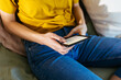 © BONNINSTUDIO/Stocksy - Crop woman reading electronic book
