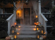 © Lexia Frank/Stocksy - front porch halloween decor after dark
